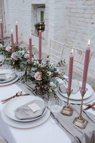 dusty rose wedding candles and flowers centerpiece on grey tablerunner agnes black