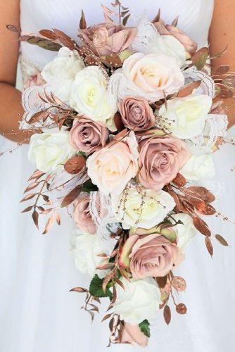 dusty rose wedding cascading bridal bouquet with white roses and pink gold leaves budgetbride