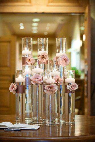 dusty rose wedding tall glass vace with water and candles decorated with roses whitelilacinc