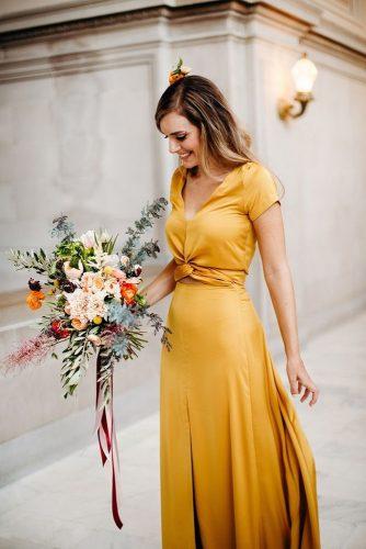 mustard wedding bridal dress with bouquet clara rice photography