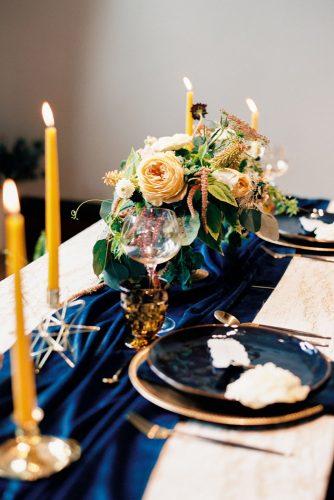 mustard wedding bright table dark electric blue tablerunner yellow candles and flower centerpiece ashley rains photography