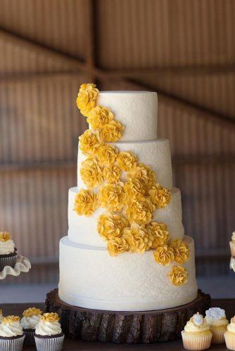 mustard wedding tall white bridal cake with yellow flowers we heart photography