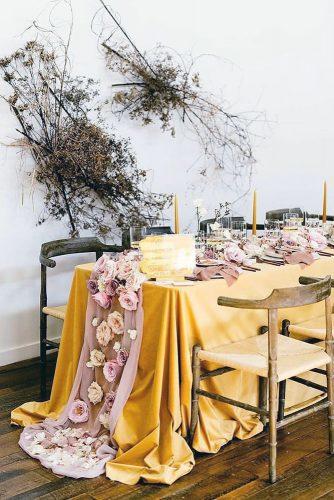 mustard wedding with long tablecloth and pink accent and roses morganfranklincreative