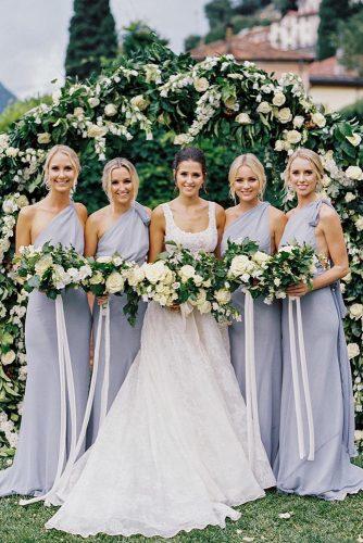 wedding colors 2019 bride and bridesmaids in grey dresses with white and greenery wedding bouquets katiegrantphoto
