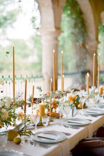 wedding colors 2019 mustard yellow centerpieces with candles and flowers on long table jose villa