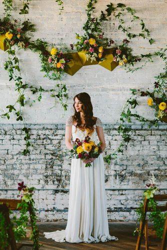 wedding colors 2019 mustard yellow flowers on wedding backdrop and bridal bouquets redfield photo