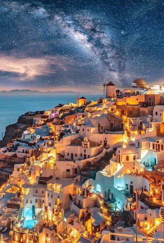 best honeymoon destinations evening lighting santorini greece wu_greece
