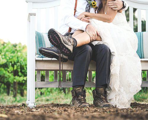 nature inspired wedding bride and groom at the bench