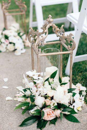 spring wedding decor aisle wintage candle lantern with fresh spring flowers annaperevertaylo