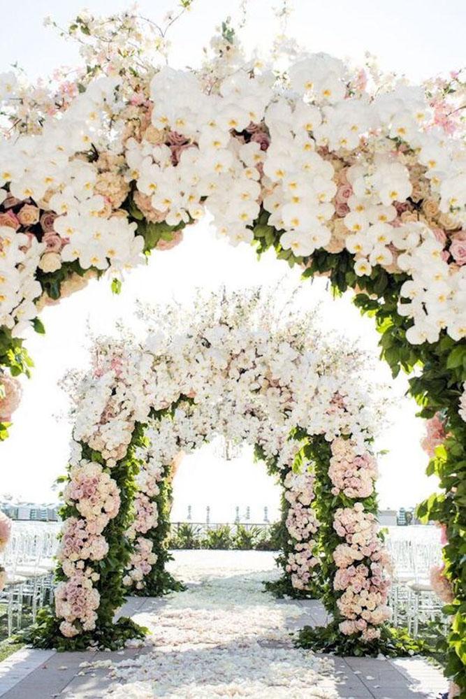 spring wedding decor aisle with flower orchid and roses arches greenery lin and jirsa studios