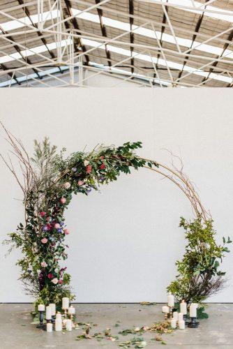 spring wedding decor round shaped altar with flowers and greenery bird on the wall photography