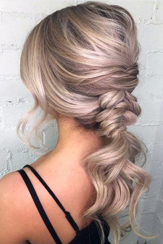 valentines day hairstyles stylish blonde ponytail braided with soft waves on blonde hair raehairstylist