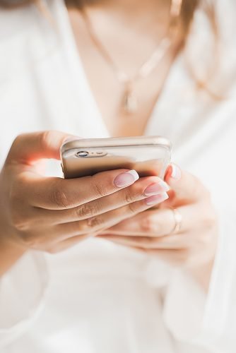 wedding checklist bride with phone planning