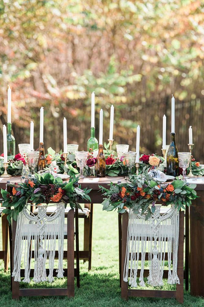 bohemian wedding decorations boho table with flowers candles in bottles and macrame on chairs the right moments photography