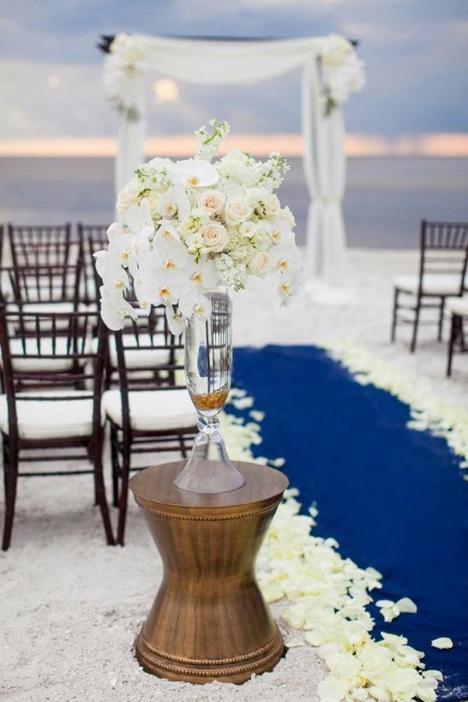 nautical wedding blue aisle with white orchids flowers in tall glass vase jamie lee photography