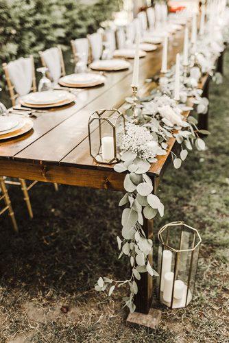 sage green wedding tablerunner greenery on wooden table with geometry terrarium with candles julie bulanov photography