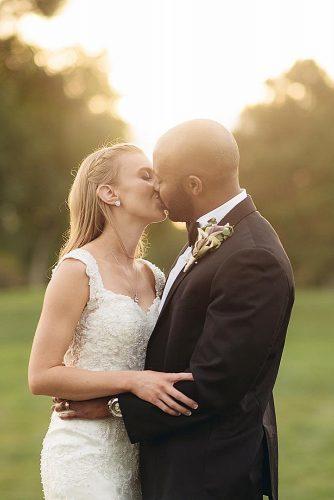 wedding photographers bride and groom kissing at the sunset brandonharwellphoto