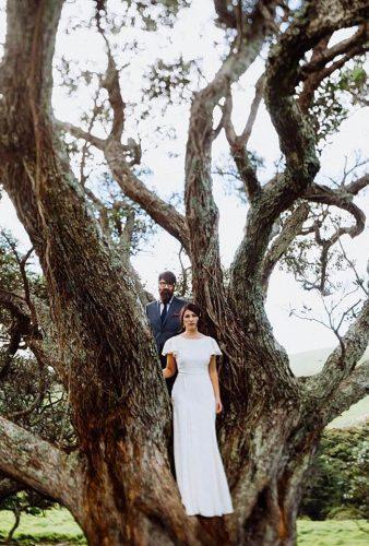 wedding photographers couple on the tree forgedinthenorth
