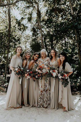 bohemian wedding look for bridesmaids in sage green dresses and protea bouquets brooke taelor