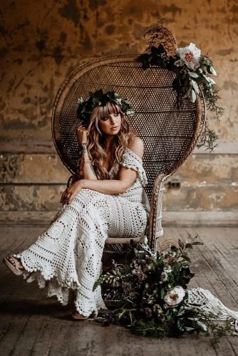 bohemian wedding look macrame bridal dress bride on boho chair with greenery and flowers willkhouryphotography