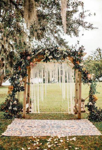 boho wedding trends arch near tree Shannon Lee Miller