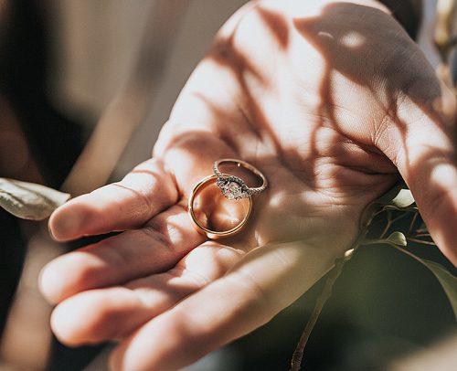how to measure ring size hand holding engagement and wedding rings