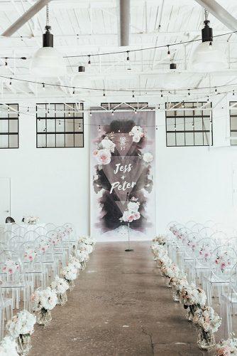 modern wedding decor ideas minimalist white grey ceremony with pink flowers on backdrop chairs and aisle avenew studios