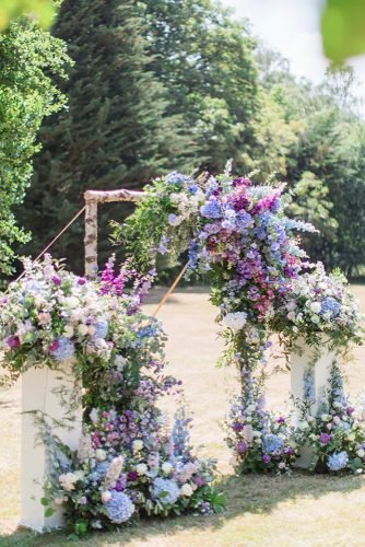 natural wedding décor blue lilac and greenery flower on bridal arch cecelinaphotography