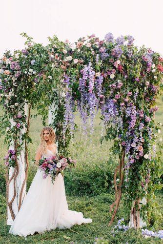 natural wedding décor outdoor bright flower wedding arch with purpletreephotography