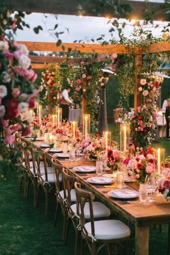 natural wedding décor outdoor reception with candles and flowers bryanmillerphoto