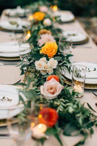 natural wedding décor table runner with greenery and mustard orange roses alyssaencephotography