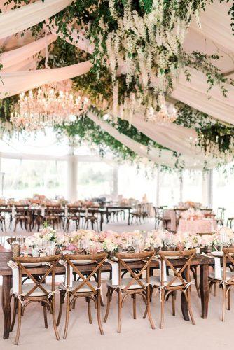 natural wedding decor reception under white tent with greenery and hanging whte flowers valoriedarling