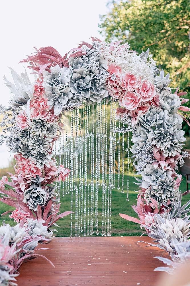 silver wedding decor ideas arch with pink flowers and crystals pinewood weddings