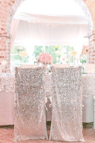 silver wedding decor ideas reception with sparkle tablecloth and chairs pink roses on table amalie orrange