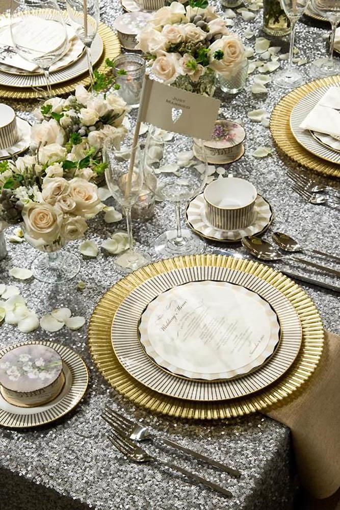 silver wedding decor ideas sparkle tablecloth and gold plates bbjlinen