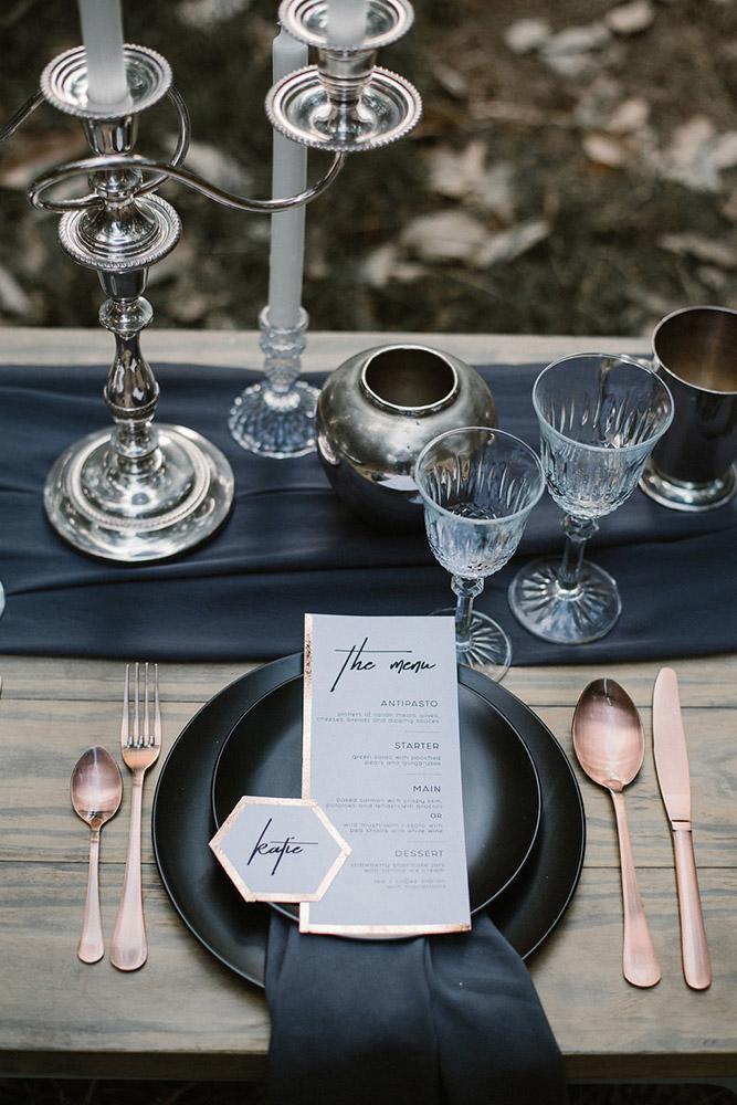 silver wedding decor ideas table with dark dishes and tablerunners mlk photography