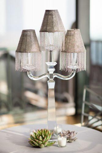 silver wedding decor ideas vintage lamp on mirror stand non floral centerpiece ira lippke studios