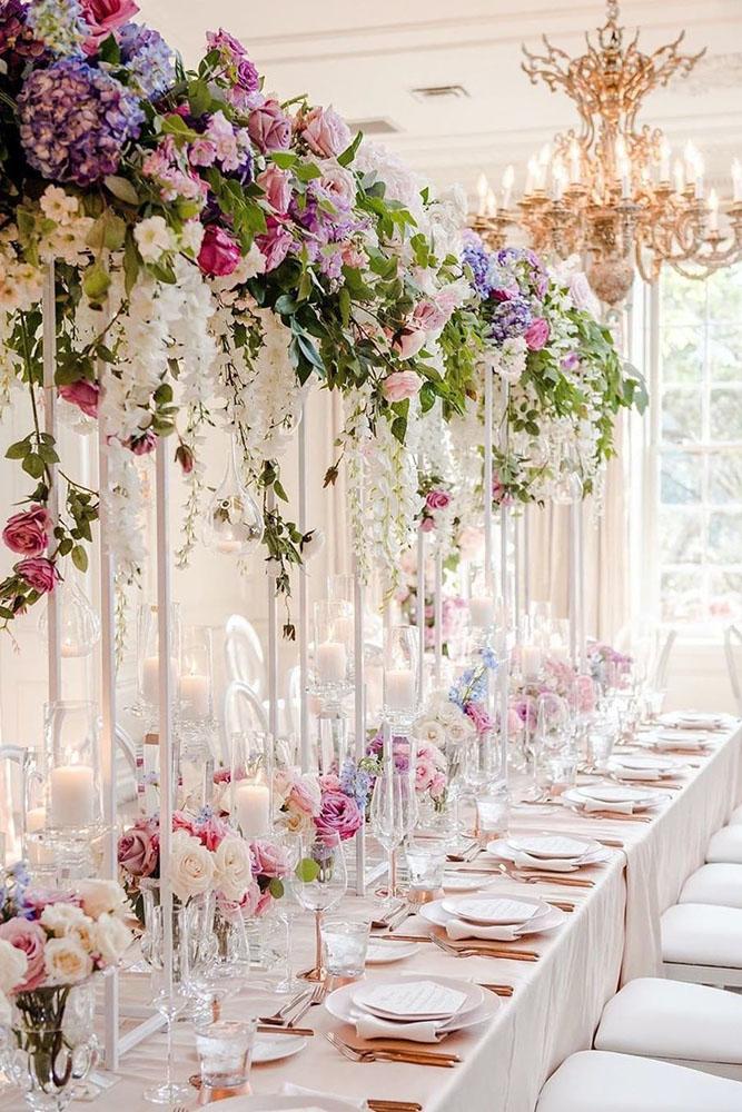 summer wedding trends tall with bright cascading flowers on all white reception agistudio