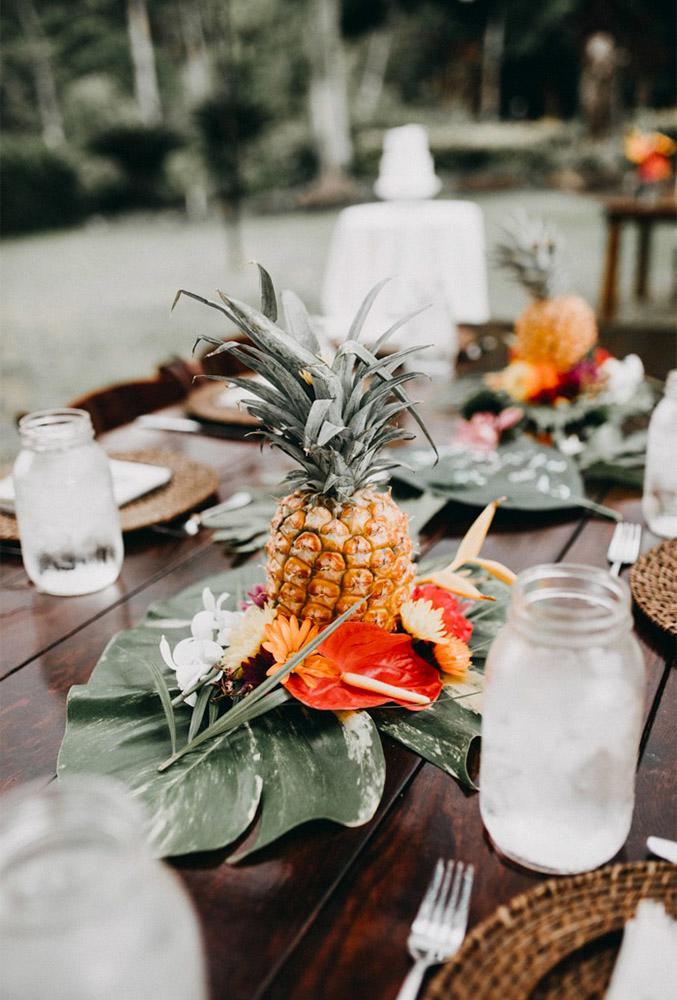 tropical wedding decor centerpiece pineapple Roy Nuesca Photography