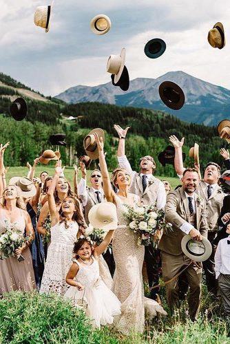 wedding photo checklist informal shot newlyweds with friends and family