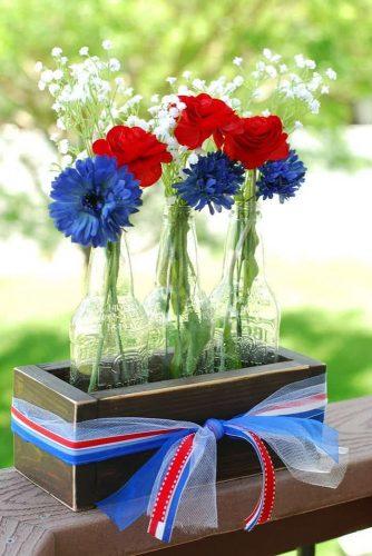 independence-day-wedding-4th-of-july-centerpiece-in-wooden-crates-with-flowers-and-blue-white-red-ribbons-creationsbykara