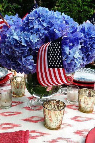 independence day wedding 4th of july centerpiece with blue flowers and american flags danielledrollins