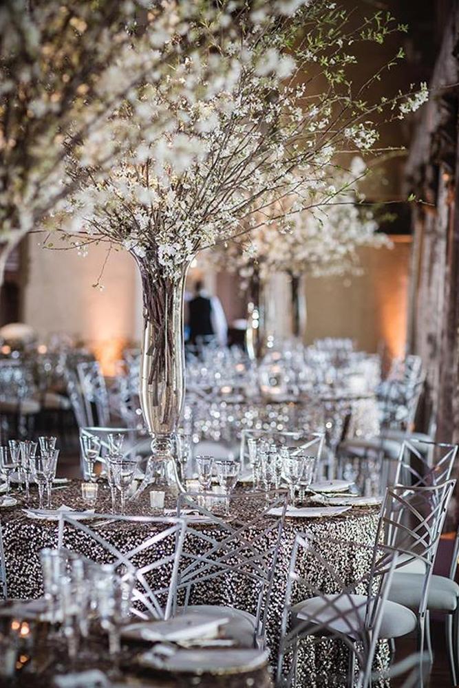 silver wedding decor ideas tall tree centerpiece with white flowers on table brian adams photo