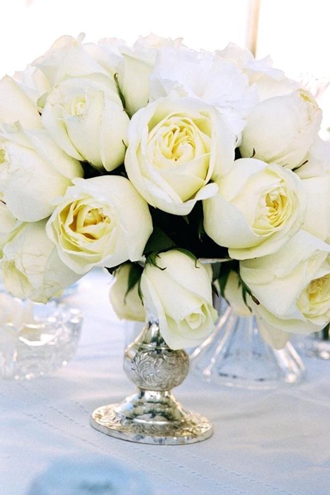 silver wedding decor ideas white roses in vintage silver vase yvette roman photography