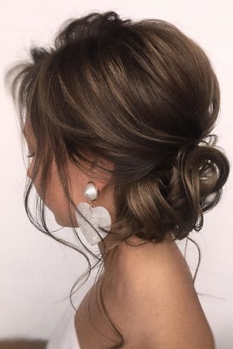 curly low bun wedding hairstyles