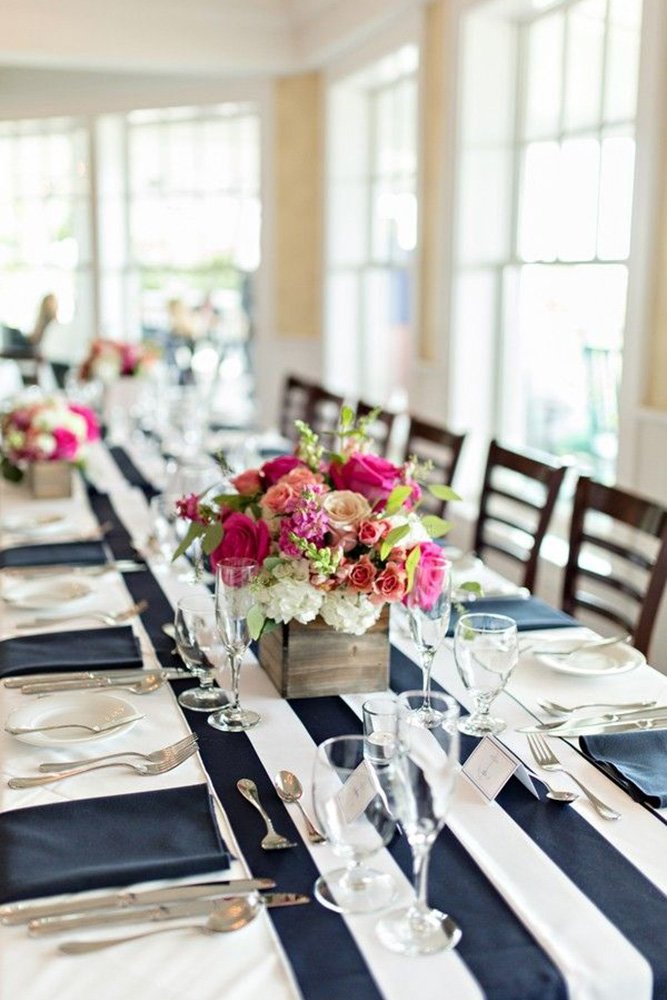 nautical wedding table decor with stripes on tablecloth flower centerpiece shoreshotz photography