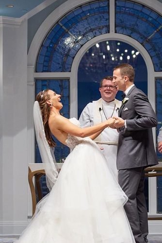 funny wedding vows newlyweds laughing at the wedding ceremony