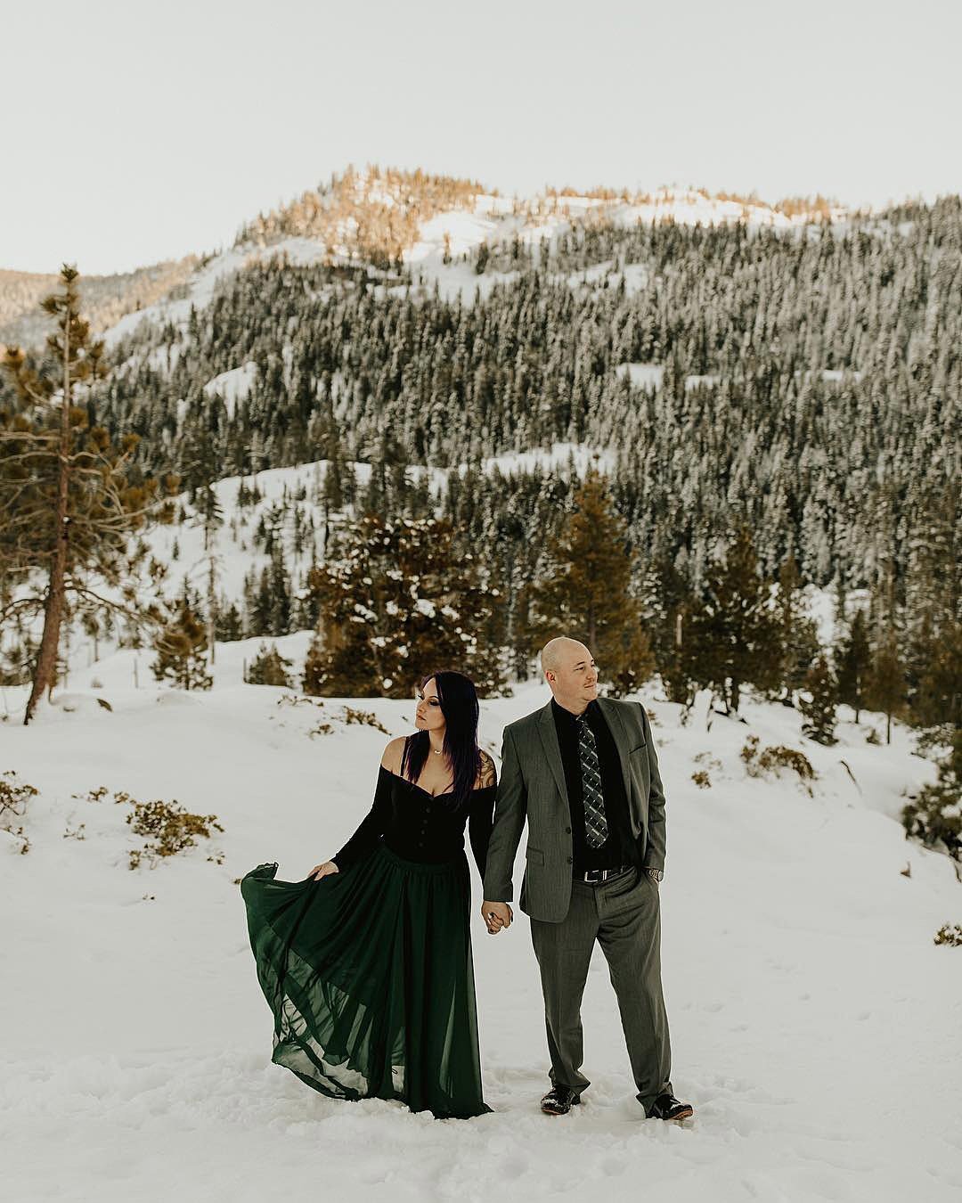 winter engagement photos charming couple near mountains