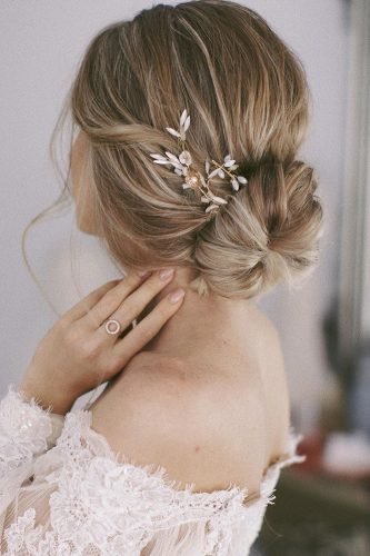wedding updos slightly messy with low bun and elegant hairpin ulyana.aster