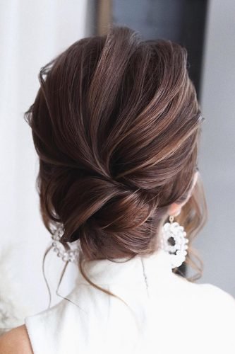 wedding updos textured low bun on dark hair tonyastylist